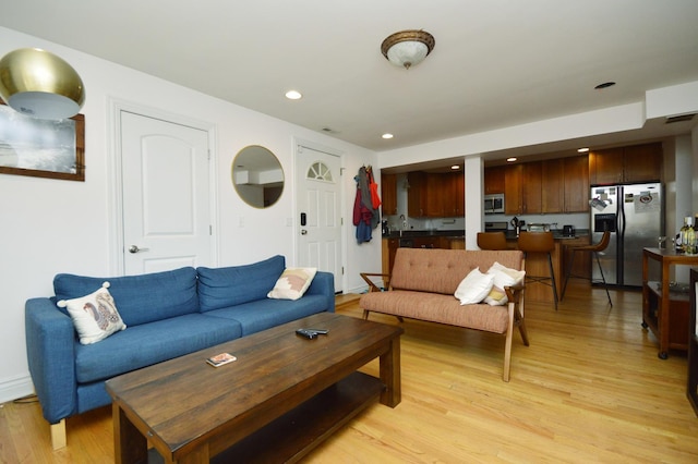 living room with light hardwood / wood-style floors