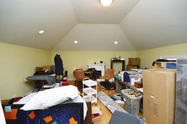 bonus room featuring vaulted ceiling and wood-type flooring