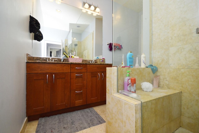 bathroom featuring tile patterned flooring and vanity