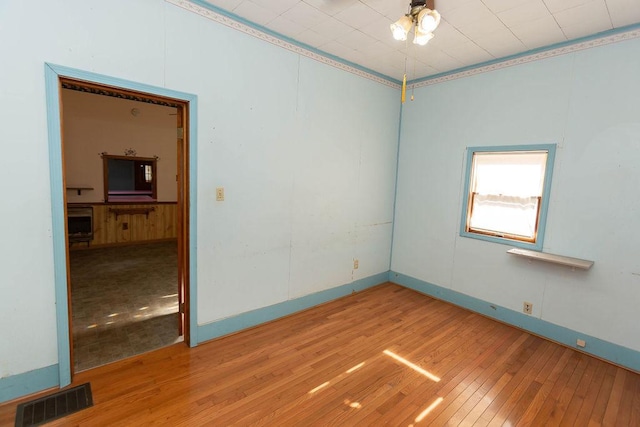 spare room with wood-type flooring