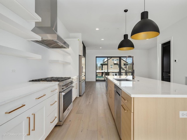 kitchen featuring sink, a center island with sink, appliances with stainless steel finishes, island exhaust hood, and white cabinets