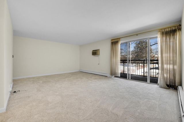 empty room featuring baseboard heating, light colored carpet, and a wall mounted AC