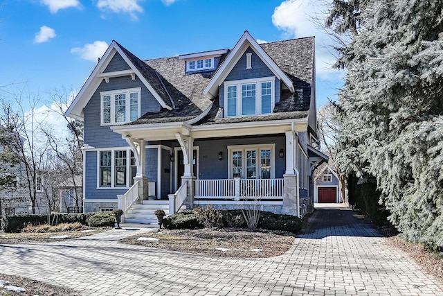 shingle-style home featuring covered porch