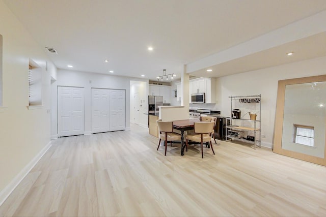 dining room featuring light hardwood / wood-style floors