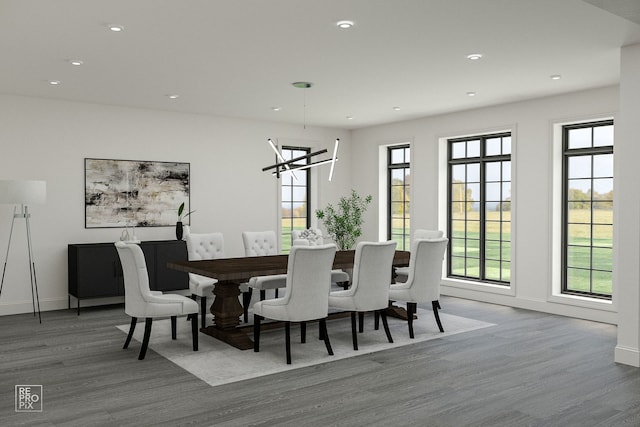 dining area with wood-type flooring and a chandelier