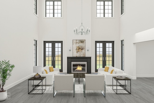 living room with french doors and wood-type flooring