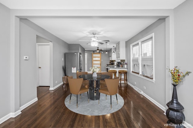 dining room featuring dark wood-type flooring and ceiling fan