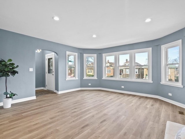 spare room featuring light hardwood / wood-style flooring