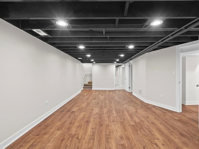 basement featuring wood-type flooring