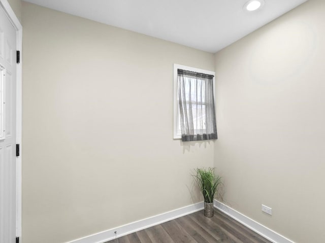 empty room with dark wood-type flooring