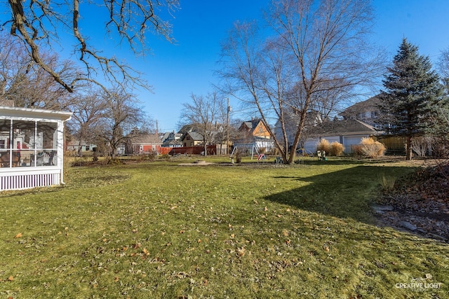 view of yard featuring a sunroom