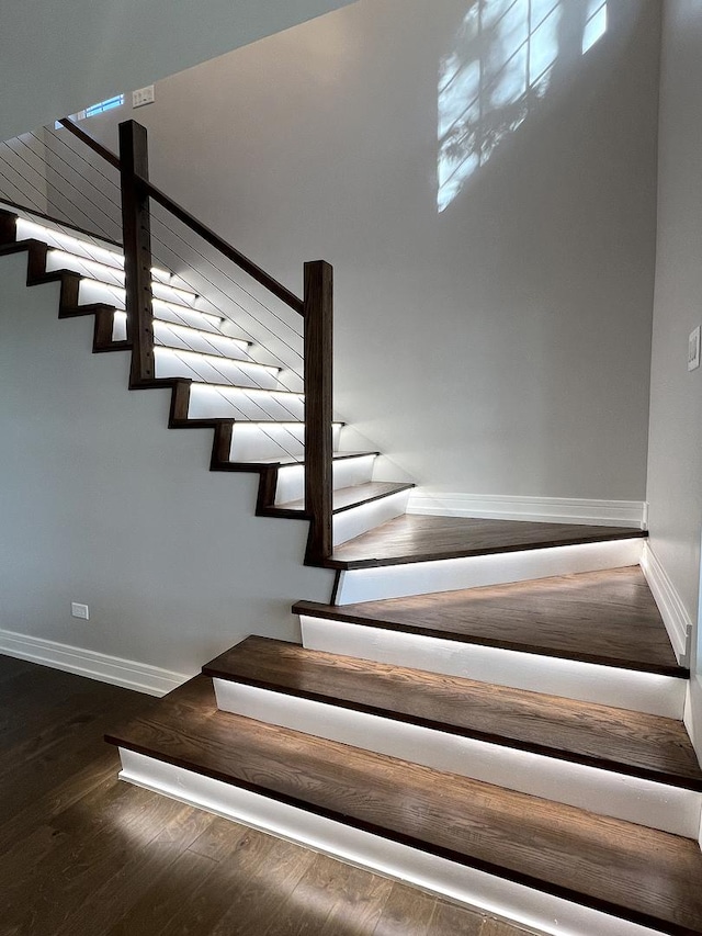 staircase featuring hardwood / wood-style floors