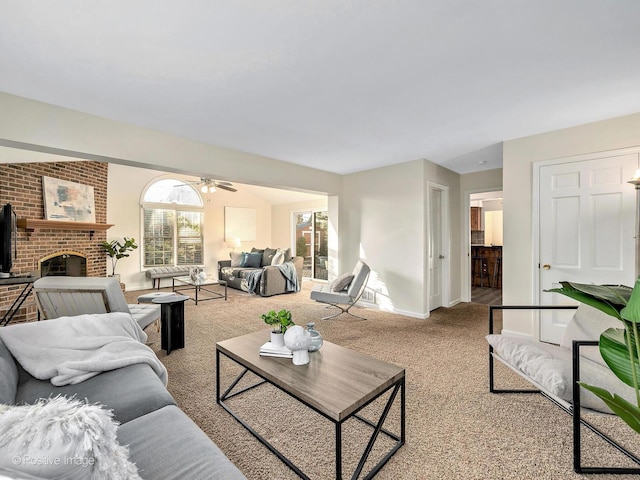 carpeted living room with a brick fireplace and baseboards