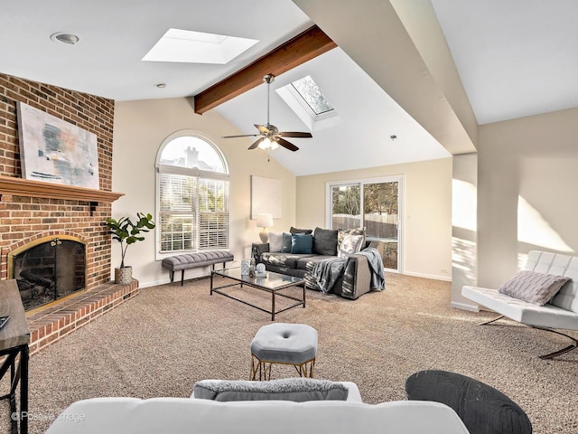 carpeted living room with lofted ceiling with skylight, ceiling fan, a fireplace, and baseboards