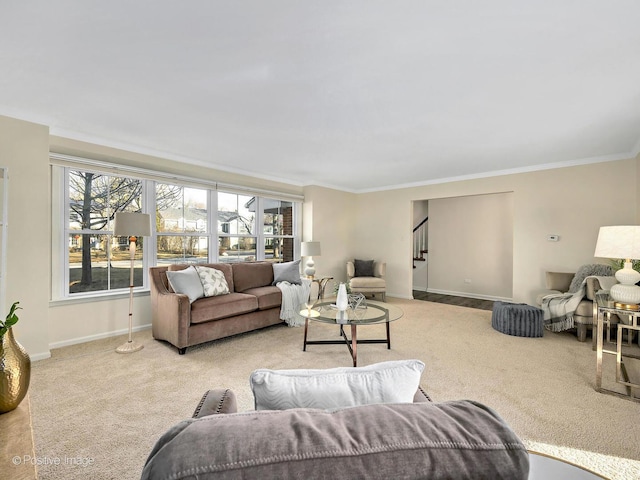 carpeted living area with baseboards, stairway, and crown molding