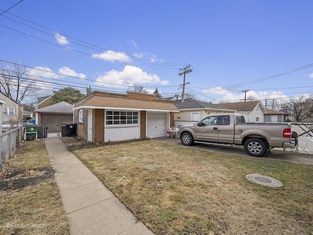 view of front of home with a garage, a front yard, a gate, and fence