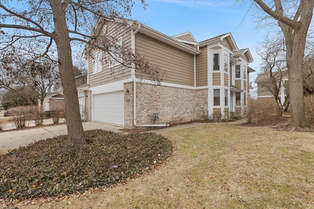 view of property exterior featuring a garage and a lawn