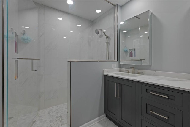 bathroom featuring vanity and a shower with shower door