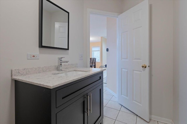 bathroom featuring tile patterned flooring and vanity