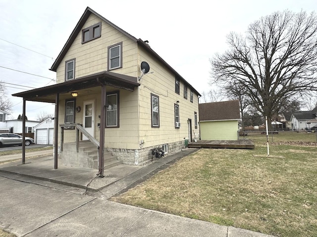 view of front of property with covered porch and a front lawn