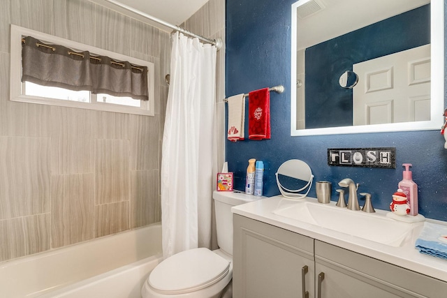 full bathroom with vanity, toilet, and shower / tub combo