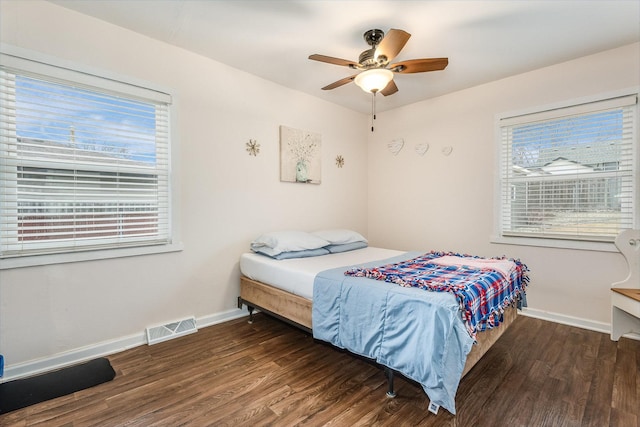 bedroom featuring ceiling fan and dark hardwood / wood-style flooring