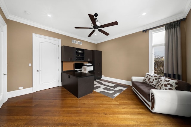 office area featuring ornamental molding, wood finished floors, visible vents, and baseboards