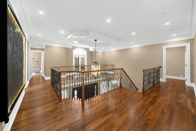 hall with crown molding, recessed lighting, an upstairs landing, wood finished floors, and baseboards