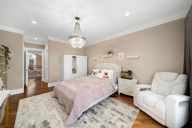 bedroom featuring dark wood-style floors, a chandelier, ornamental molding, and baseboards