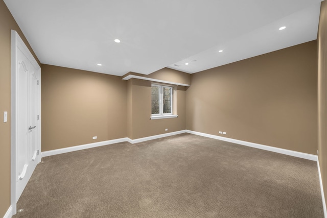 carpeted spare room with recessed lighting and baseboards