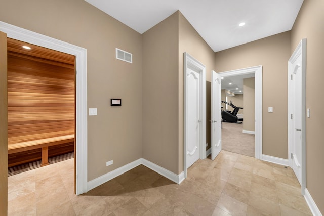 hallway featuring a sauna, recessed lighting, visible vents, and baseboards