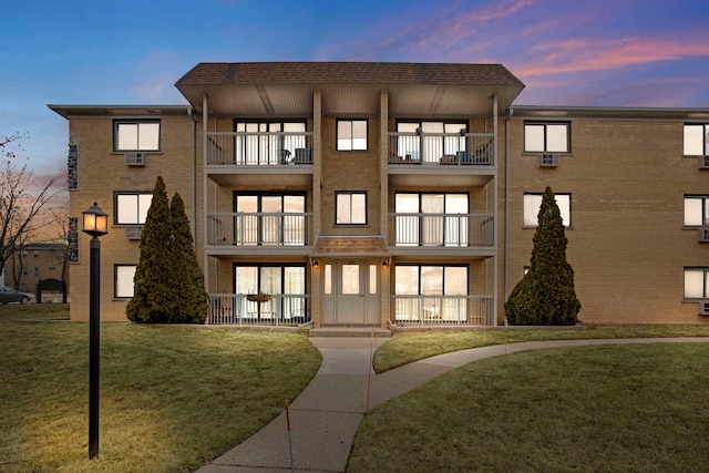 view of outdoor building at dusk