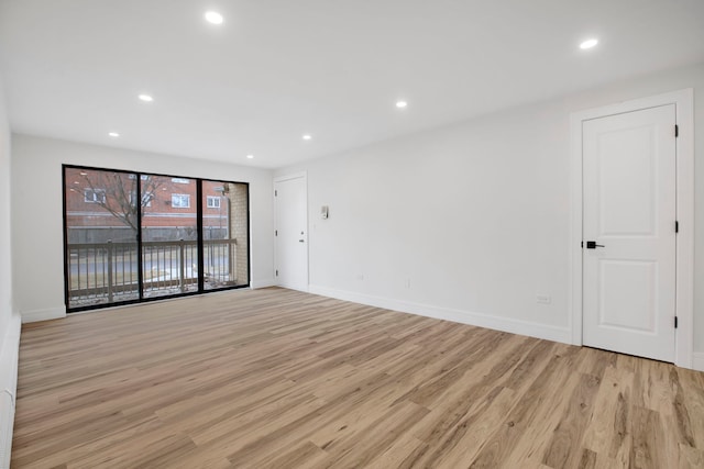 spare room featuring light hardwood / wood-style flooring