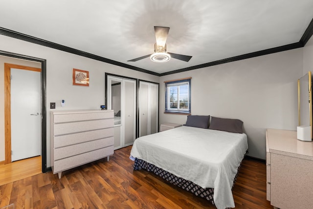 bedroom featuring dark hardwood / wood-style flooring, ornamental molding, a closet, and ceiling fan