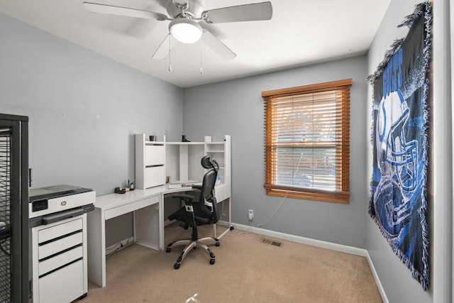 office space with light colored carpet and ceiling fan