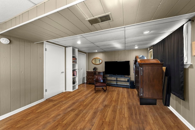 sitting room featuring dark wood-type flooring