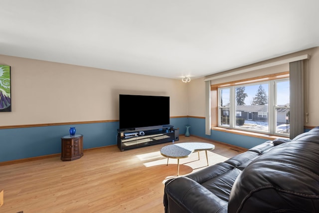 living room with light hardwood / wood-style floors