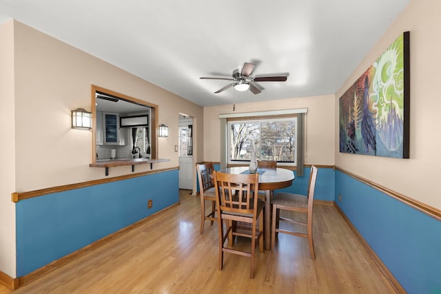 dining area featuring ceiling fan and light hardwood / wood-style flooring