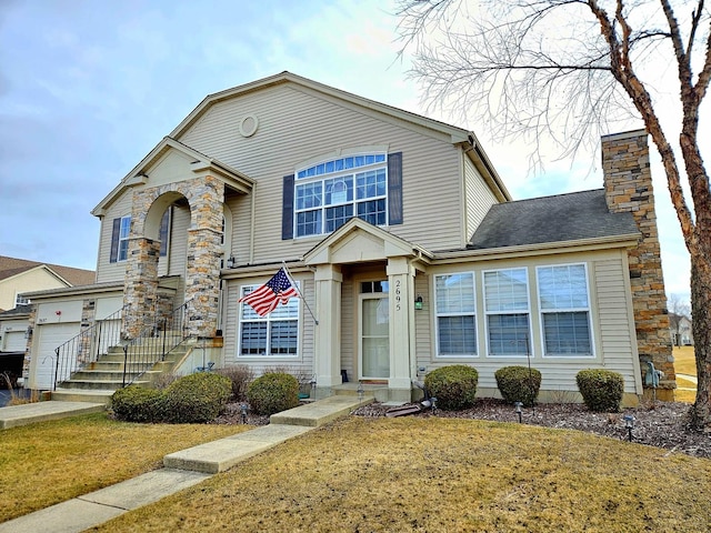 view of front of house featuring a garage and a front yard