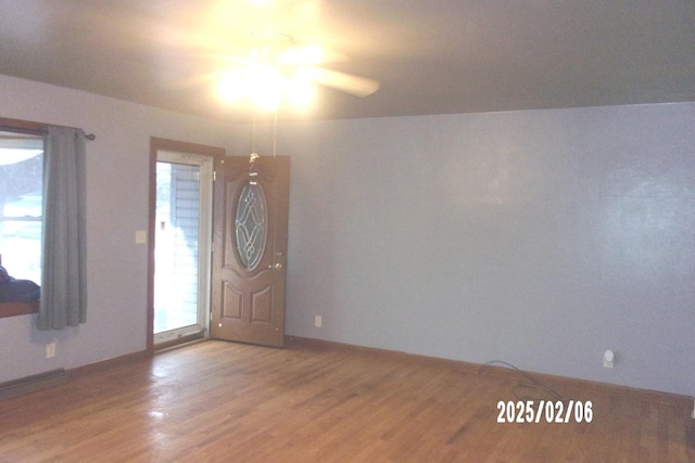 foyer featuring hardwood / wood-style flooring and ceiling fan