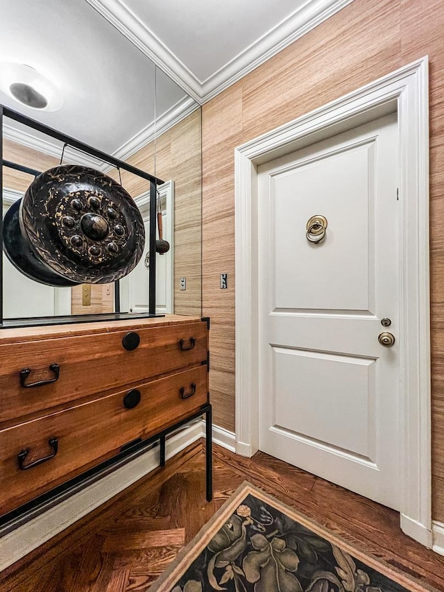 entryway with crown molding and dark hardwood / wood-style floors