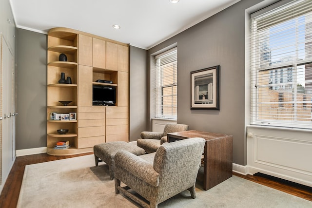 living area with hardwood / wood-style floors