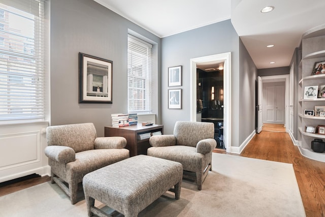 living area with hardwood / wood-style floors