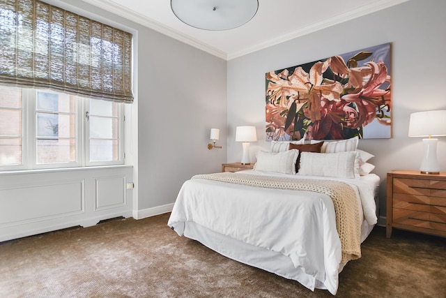 bedroom featuring dark colored carpet and ornamental molding