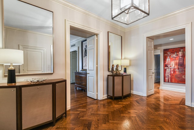 hallway featuring a notable chandelier, dark parquet flooring, and ornamental molding