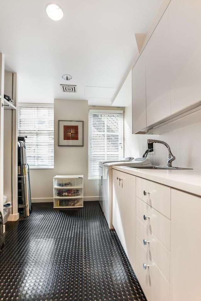 kitchen featuring sink and dark colored carpet