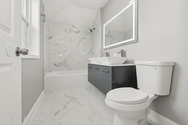 full bathroom with vanity, tiled shower / bath, and toilet