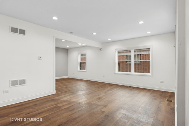 spare room with dark hardwood / wood-style floors