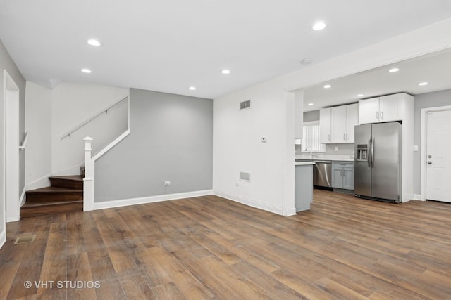 unfurnished living room featuring wood-type flooring