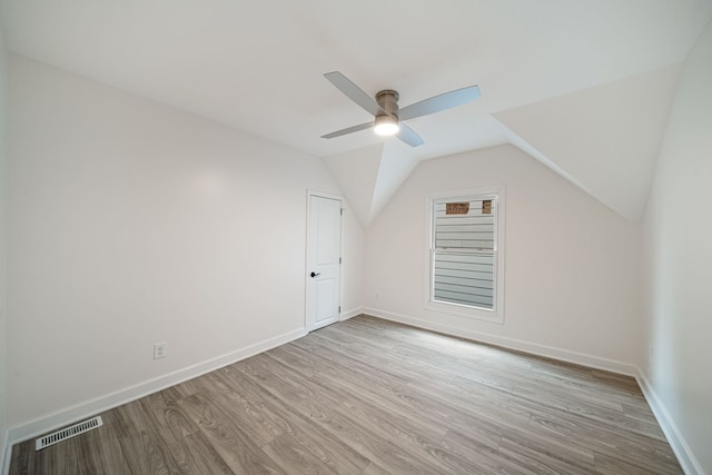 bonus room with ceiling fan, lofted ceiling, and light hardwood / wood-style floors